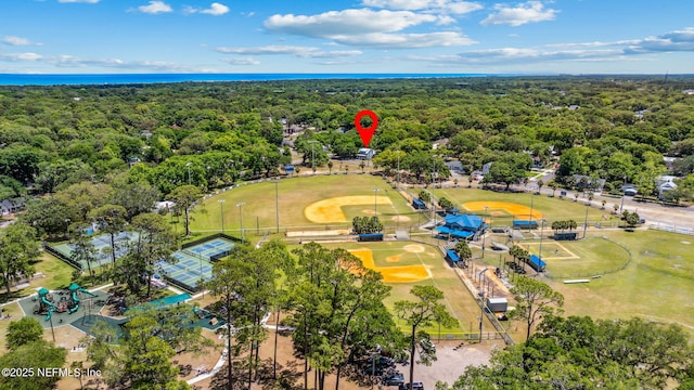 drone / aerial view with a view of trees