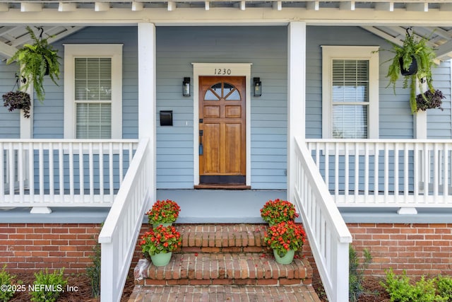 1230 Beech St, Fernandina Beach, FL 32034 - property entrance featuring a porch