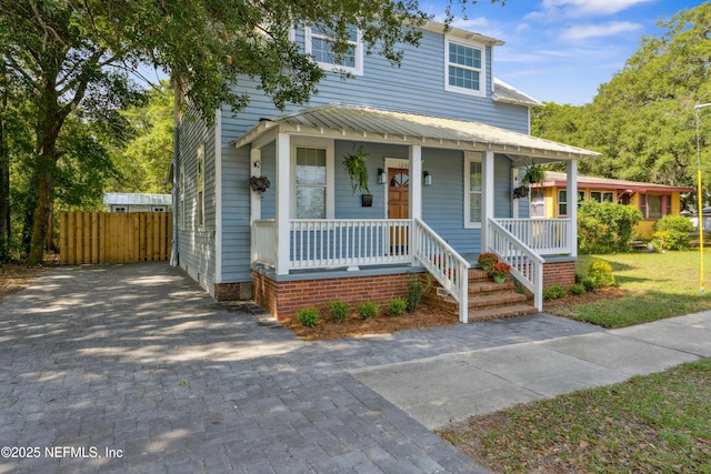 1230 Beech St, Fernandina Beach, FL 32034 - view of front of property featuring a porch and fence