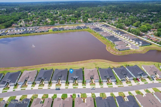 birds eye view of property featuring a water view and a residential view