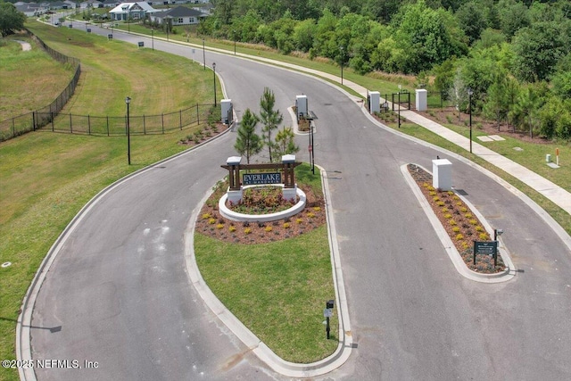 exterior space featuring curbs and street lights