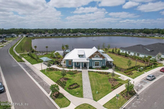 birds eye view of property with a water view