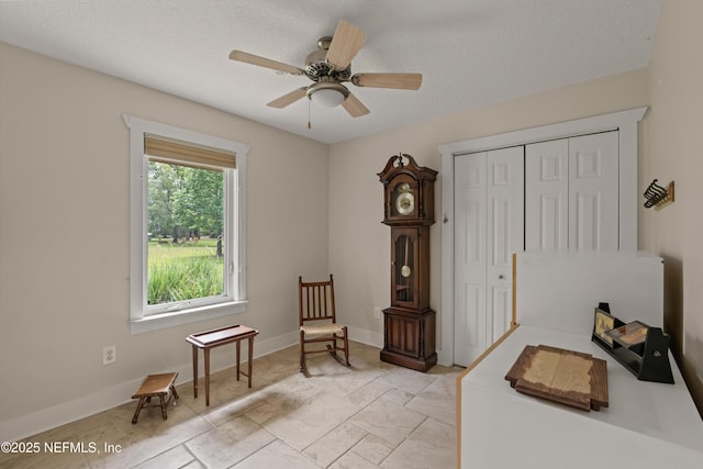 bedroom featuring a closet, baseboards, and a ceiling fan