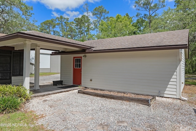 view of front of home featuring roof with shingles