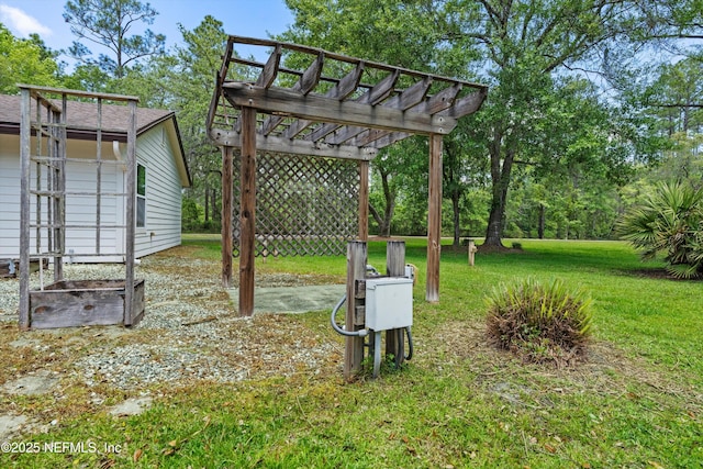 view of green lawn with a pergola