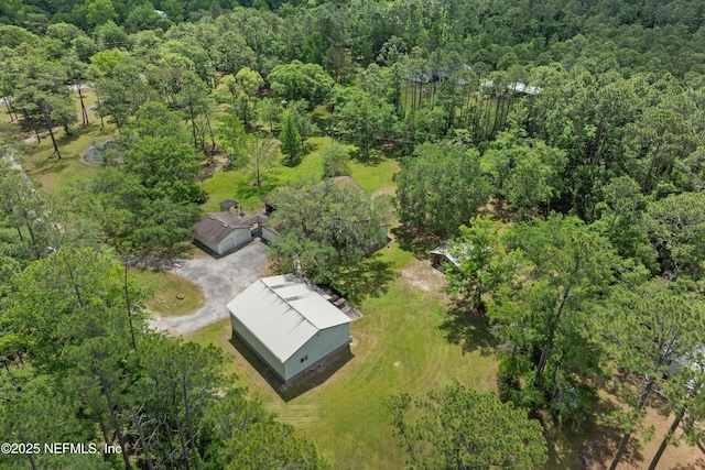 view of property location featuring a heavily wooded area