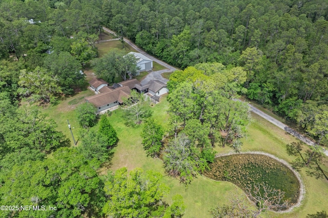 view of property location featuring a heavily wooded area