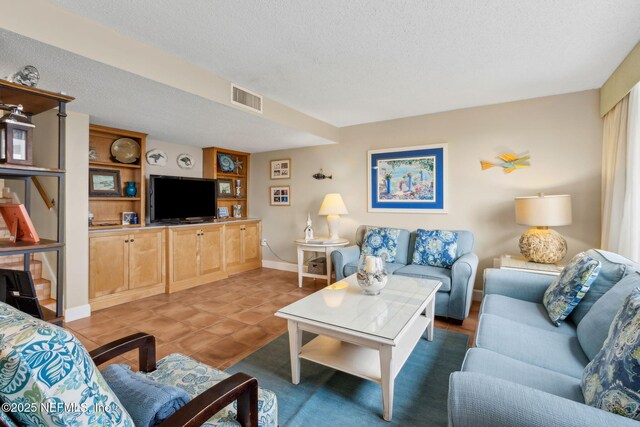 1029 Captains Court Dr Unit 1029, Fernandina Beach, FL 32034 - living area with a textured ceiling, baseboards, and tile patterned flooring