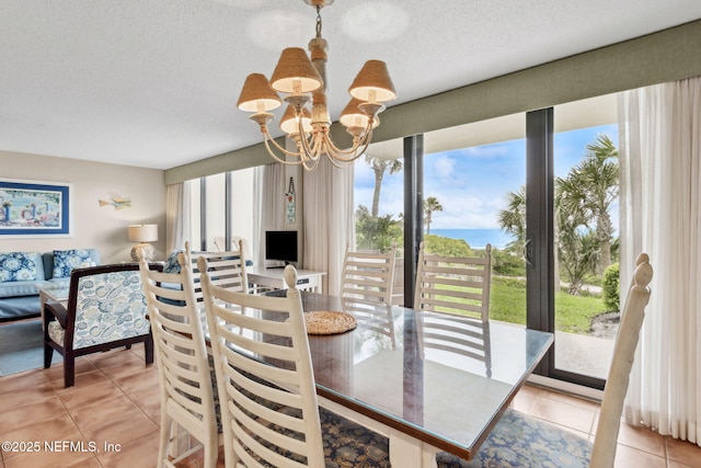 1029 Captains Court Dr Unit 1029, Fernandina Beach, FL 32034 - dining area with a chandelier, light tile patterned floors, and a textured ceiling