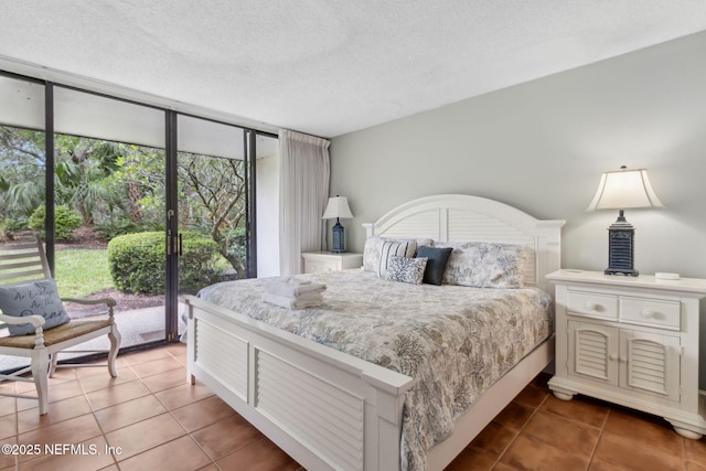 1029 Captains Court Dr Unit 1029, Fernandina Beach, FL 32034 - tiled bedroom with access to outside, a wall of windows, and a textured ceiling