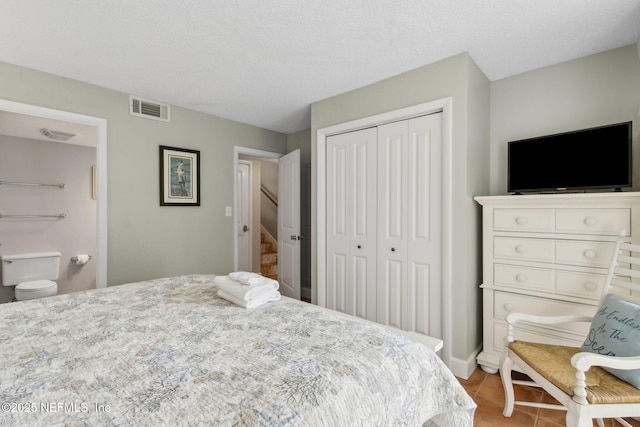 1029 Captains Court Dr Unit 1029, Fernandina Beach, FL 32034 - bedroom featuring a closet, tile patterned flooring, and baseboards