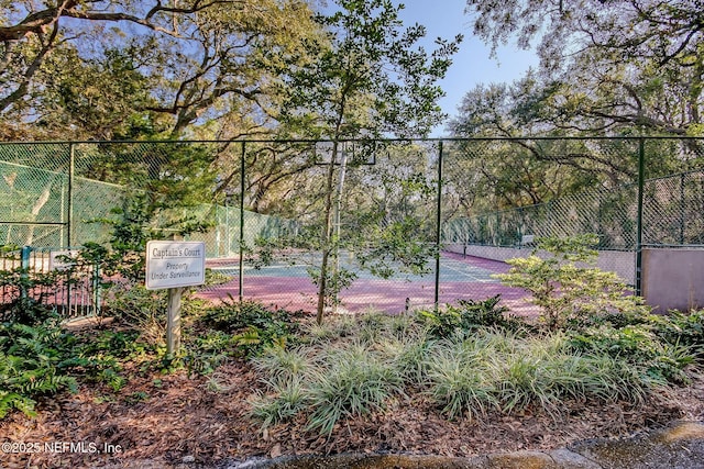 1029 Captains Court Dr Unit 1029, Fernandina Beach, FL 32034 - view of tennis court featuring fence