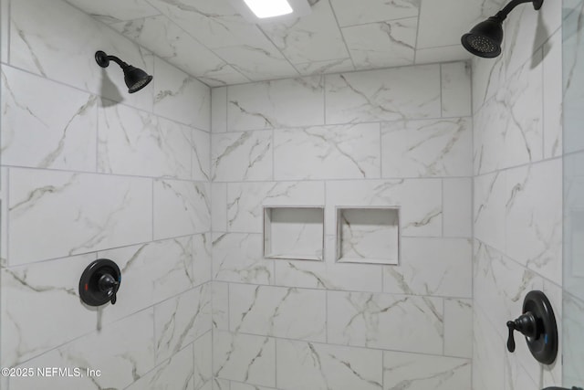 bathroom featuring a tile shower