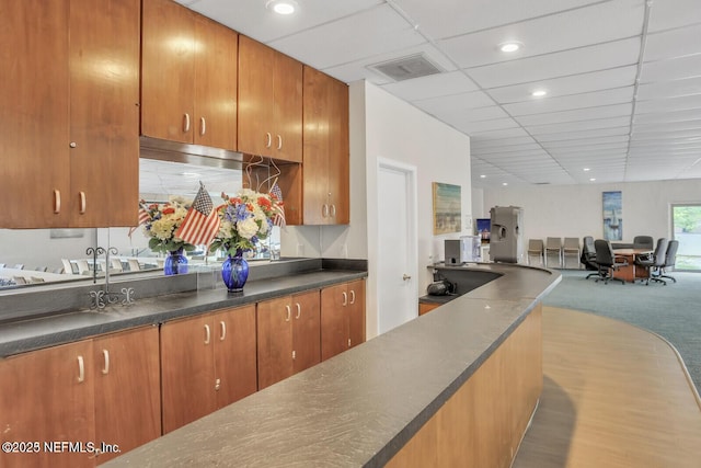 9252 San Jose Blvd Unit 2002, Jacksonville, FL 32257 - kitchen with dark countertops, open floor plan, carpet floors, and a drop ceiling