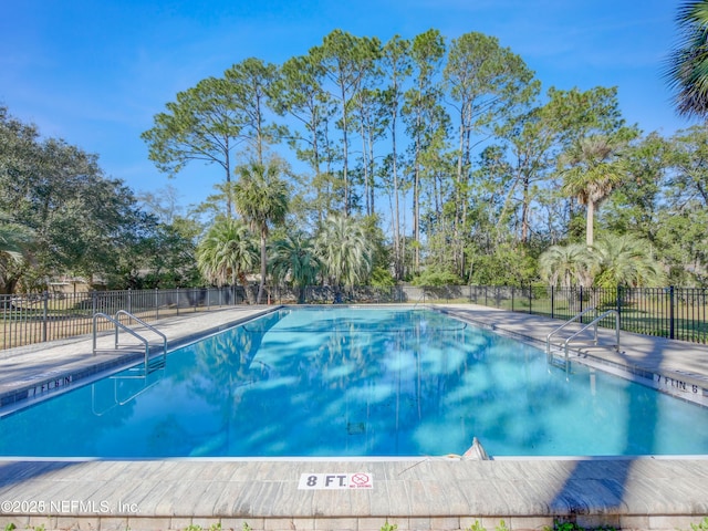 9252 San Jose Blvd Unit 2002, Jacksonville, FL 32257 - community pool featuring fence and view of wooded area
