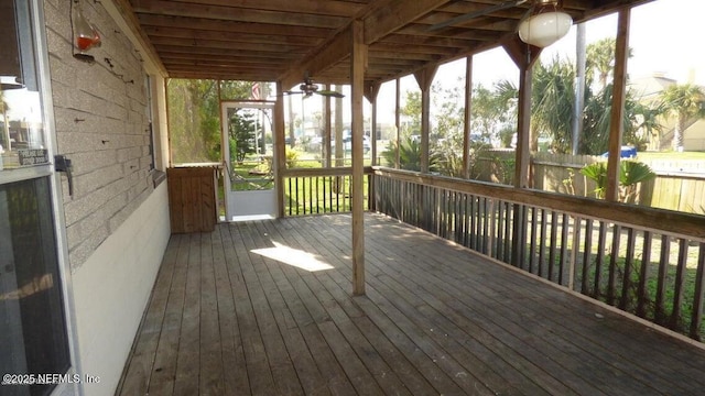 wooden deck featuring a sunroom