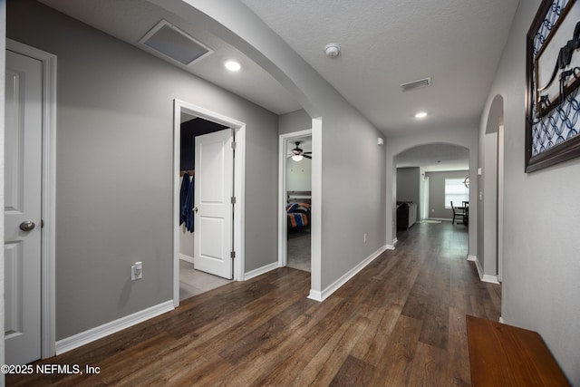 19533 NW 229th St, High Springs, FL 32643 - hallway featuring arched walkways and dark wood finished floors