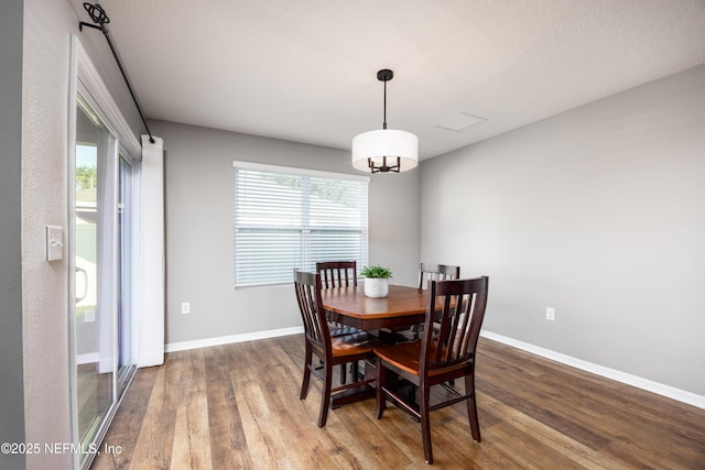 19533 NW 229th St, High Springs, FL 32643 - dining room featuring wood finished floors and plenty of natural light