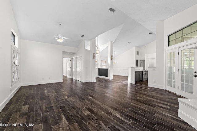 unfurnished living room with high vaulted ceiling, ceiling fan, wood finished floors, and plenty of natural light