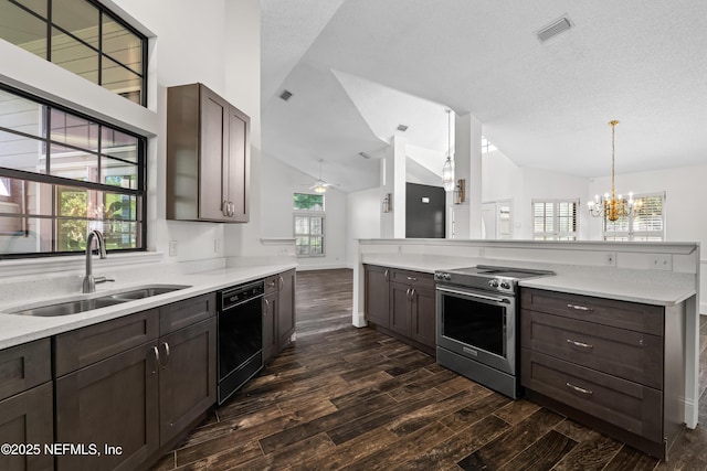 kitchen featuring dark wood finished floors, dishwasher, visible vents, a sink, and stainless steel electric range