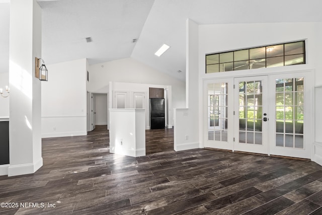 unfurnished living room with visible vents, french doors, baseboards, high vaulted ceiling, and dark wood-style flooring