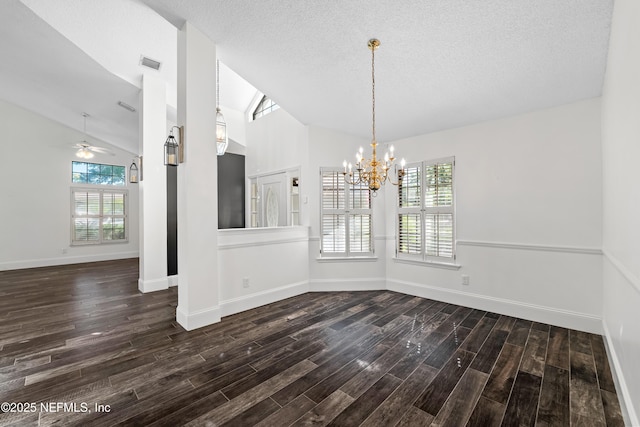 unfurnished dining area featuring dark wood-style floors, baseboards, visible vents, lofted ceiling, and ceiling fan with notable chandelier