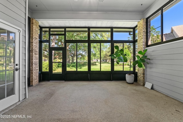 unfurnished sunroom with french doors