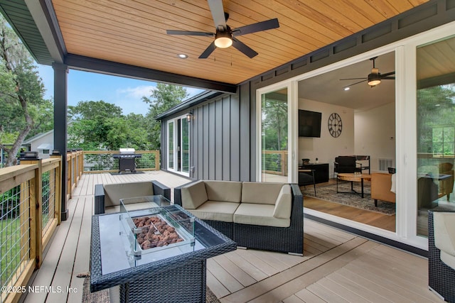 deck with a ceiling fan, an outdoor living space with a fire pit, a grill, and visible vents