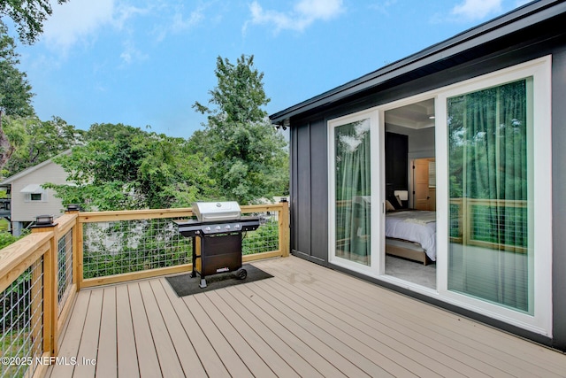 wooden terrace with area for grilling