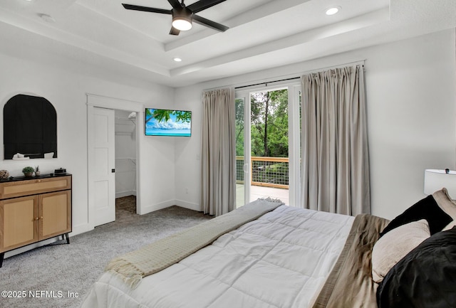 bedroom with light carpet, a raised ceiling, baseboards, access to outside, and recessed lighting