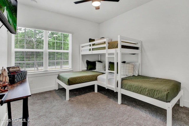 bedroom featuring baseboards, carpet floors, and ceiling fan