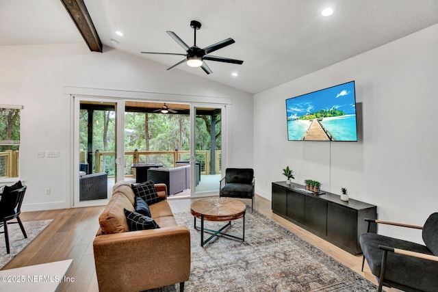 living area with lofted ceiling with beams, wood finished floors, recessed lighting, and ceiling fan