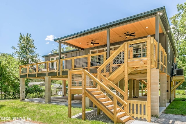 rear view of property with a wooden deck, stairway, a ceiling fan, and board and batten siding
