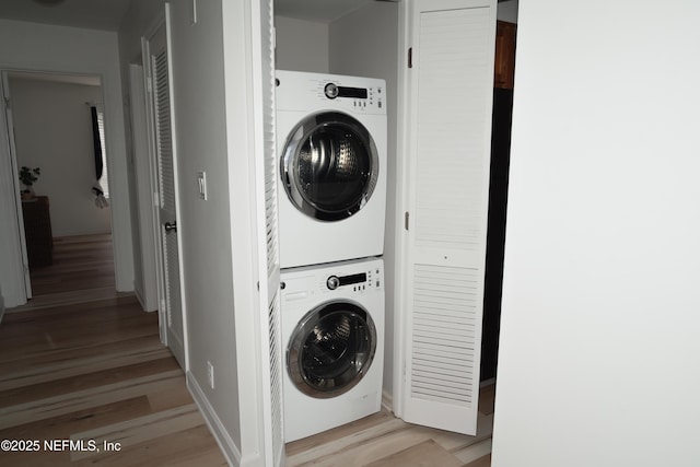 661 Ponte Vedra Blvd Unit 661B, Ponte Vedra Beach, FL 32082 - washroom featuring stacked washer / drying machine, light wood finished floors, and laundry area