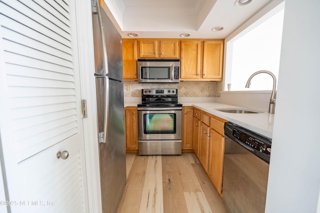 661 Ponte Vedra Blvd Unit 661B, Ponte Vedra Beach, FL 32082 - kitchen featuring tasteful backsplash, a sink, stainless steel appliances, light countertops, and light wood finished floors