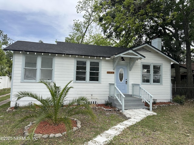 4848 Sappho Ave, Jacksonville, FL 32205 - bungalow-style home with a chimney and fence