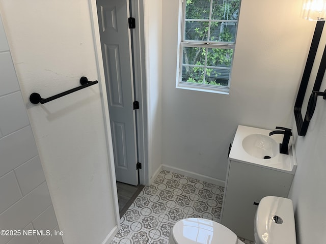 4848 Sappho Ave, Jacksonville, FL 32205 - half bath with baseboards, vanity, and toilet