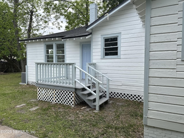 4848 Sappho Ave, Jacksonville, FL 32205 - rear view of property featuring a yard, a chimney, and a deck