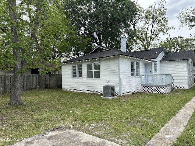 4848 Sappho Ave, Jacksonville, FL 32205 - view of property exterior featuring fence, a wooden deck, a yard, and central AC unit