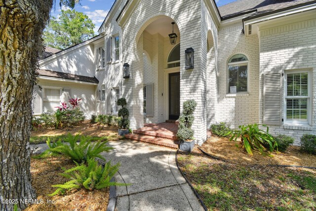 6230 Highlands Ct, Ponte Vedra Beach, FL 32082 - doorway to property featuring brick siding and roof with shingles