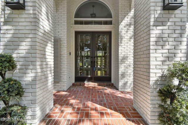 6230 Highlands Ct, Ponte Vedra Beach, FL 32082 - property entrance featuring french doors and brick siding