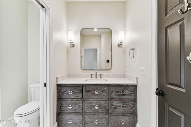 6230 Highlands Ct, Ponte Vedra Beach, FL 32082 - bathroom with toilet, vanity, and baseboards