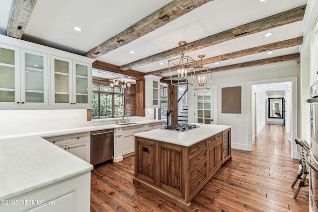 6230 Highlands Ct, Ponte Vedra Beach, FL 32082 - kitchen with stainless steel appliances, a sink, dark wood-type flooring, a kitchen island, and white cabinets