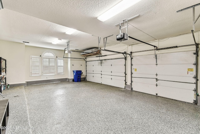 6230 Highlands Ct, Ponte Vedra Beach, FL 32082 - garage with a garage door opener and baseboards