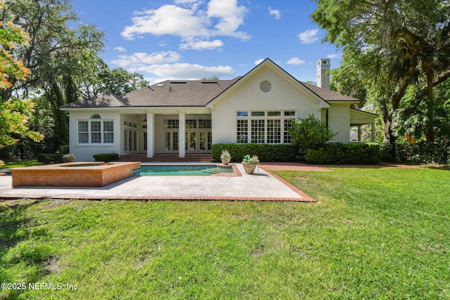 6230 Highlands Ct, Ponte Vedra Beach, FL 32082 - back of house featuring a patio, an in-ground hot tub, french doors, a chimney, and a yard