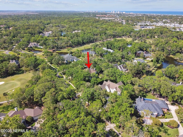 6230 Highlands Ct, Ponte Vedra Beach, FL 32082 - aerial view of property's location featuring a large body of water, nearby suburban area, a heavily wooded area, and a golf club