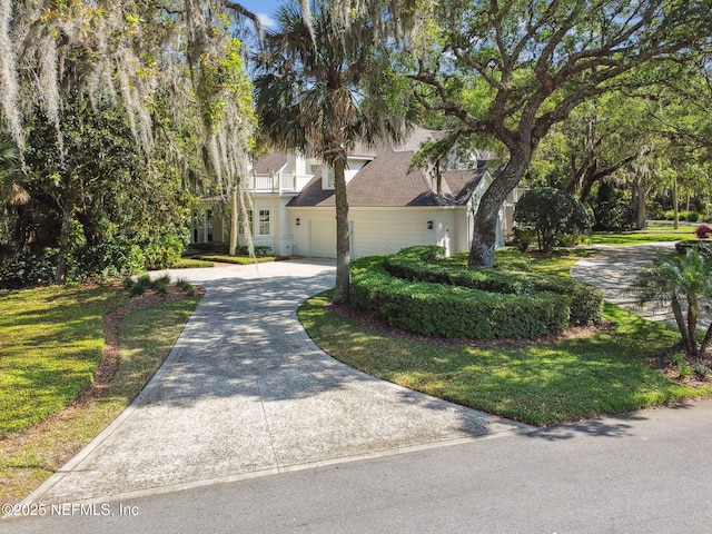 6230 Highlands Ct, Ponte Vedra Beach, FL 32082 - obstructed view of property with driveway, a garage, and a balcony