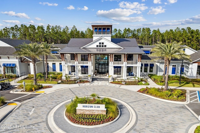 view of building exterior with curved driveway