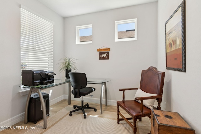 home office featuring wood finished floors and baseboards