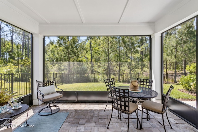 sunroom with outdoor dining space and plenty of natural light